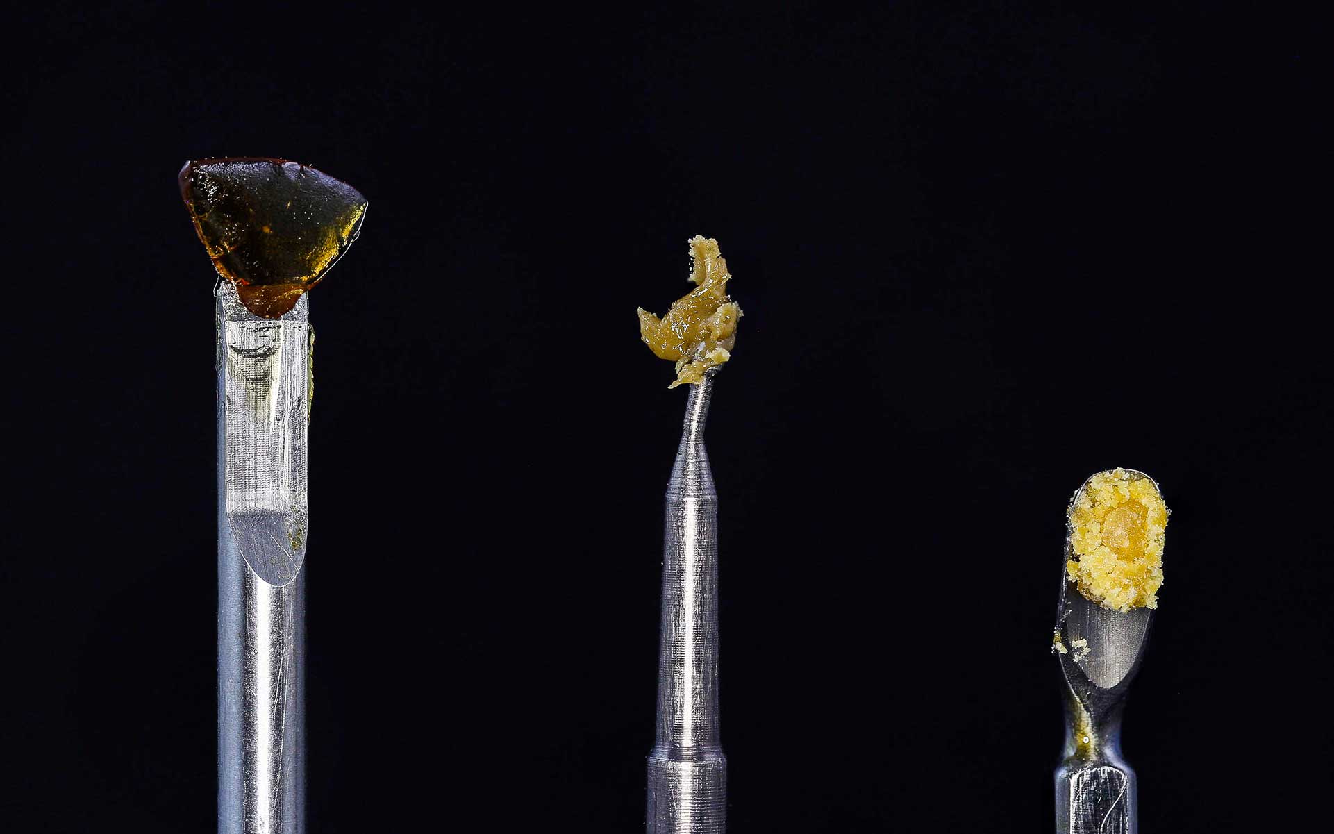 A dab tool applying THC crystals to a nail.